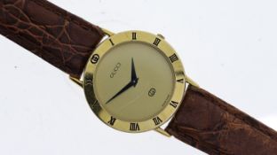 GUCCI REF 3000 M, approx 32mm gold dial, gold plated bezel engraved with Roman Numeral hour markers,