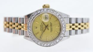 LADIES ROLEX OYSTER PERPETUAL DATE JUST REFERENCE 69173, champagne dial, after market diamond bezel,