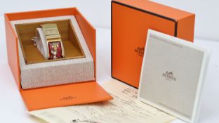 HERMES PARIS REF LO1 200 W/BOX, approx 18mm champagne dial, gold plated bezel and Hermes case,