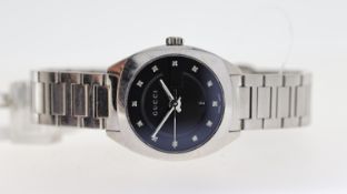 GUCCI REF 142.5, approx 28mm black dial with jewel effect hour markers, stainless steel bezel and