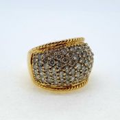 A yellow gold pave set diamond bombe ring. Marked 18K and 750 Diamond weight estimated at 2.50