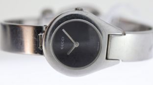 LADIES GUCCI REF 6700L, approx 25mm black dial, stainless steel bezel and case, Gucci crown and