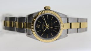 LADIES ROLEX OYSTER PERPETUAL REFERENCE 76193, black dial with gold baton hour markers, fluted