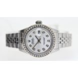 LADIES ROLEX DATEJUST DIAMOND SET CIRCA 1997, circular silver dial diamond bezel and hour markers,