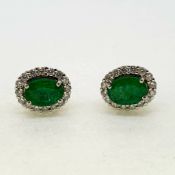 Oval emerald and diamond cluster earrings Emeralds 2.21carats Diamonds 0.68 carats 18 carat white
