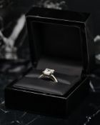3.10CT DIAMOND RING, rectangular cut diamond, claw set, mounted in platinum, estimated colour and