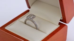 1.22ct Diamond CLuster Ring, central Emerald cut diamond estimated weight 1.05ct+ esteemed colour