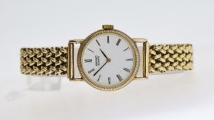 9CT SEIKO QUARTZ, approx 20mm white dial with Roman Numeral hour markers, 9ct gold case back and