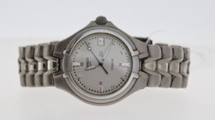 TISSOT TITANIUM REF T660 CIRCA 1990'S, approx 34mm silver dial with baton hour markers, date