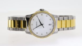 GUCCI LADIES TIMELESS REF 126.5, approx 26mm mother of pearl dial, jewel hour markers, date aperture