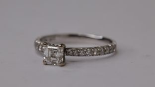 18WG SQUARE EMERALD CUT DIAMOND RING, 4 claw set with diamond to a point shoulders HM, size L. F
