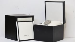 GUCCI JUMP HOUR REF 157.3 W/BOX, approx 37mm stainless steel face, date aperture with cyclops