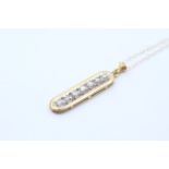 9ct gold diamond seven stone pendant necklace (1.8g)