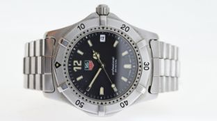 TAG HEUER PROFESSIONAL REF WK 1110, approx 35mm black dial with baton hour markers, date aperture at