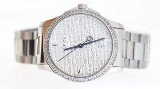 GUCCI 126.4, diamond cut dial, stone set bezel, 40mm stainless steel case and bracelet, quartz,