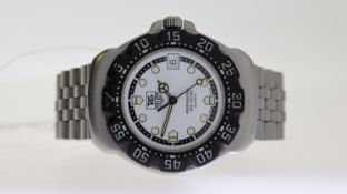 TAG HEUER PROFESSIONAL QUARTZ REFERENCE WA1218, circular white dial with dot hour markers,