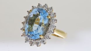 18ct Blue Topaz and Diamond Oval Cluster Ring, central oval blue topaz, claw set, estimated 14.28ct,