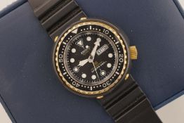 SEIKO TUNA, circular black dial with hour markers and hands, case with a crown and a case back,