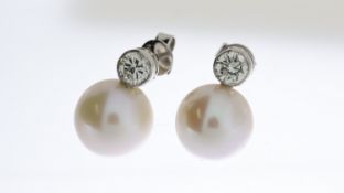 18ct Freshwater pearl and diamond earrings, bezel set diamonds D Est 1ct, Pearls 11mm