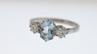Aquamarine and Diamond Three Stone Ring, oval cut Aquamarine mounted between two round cut diamonds,