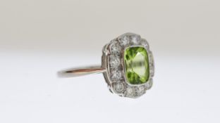 Peridot and Diamond Cluster Ring, oval cut Peridot estimated 1.50ct, mounted with brilliant cut