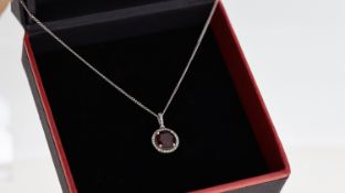 9ct Garnet and diamond pendant with chain