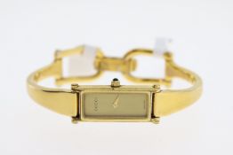 LADIES GUCCI QUARTZ COCKTAIL WATCH REFERENCE 1500, approx 13mm golden case. A plain gold coloured