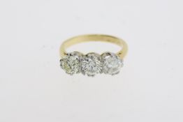 A round brilliant diamond 3 stone ring, the diamond total is estimated at 2 carats. Stamped 18CT and