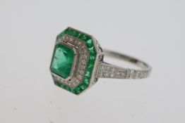 Columbian emerald and Damond set art deco style target ring in platinum. Central emerald 0.7 x 0.