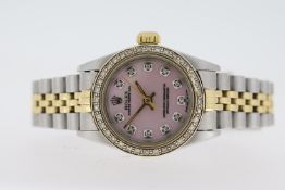 LADIES ROLEX OYSTER PERPETUAL REFERENCE 67183, aftermarket diamond set pink mother of pearl dial,
