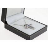 18ct white gold two piece cross pendant set with square calibre-cut sapphires and RBC diamonds on