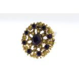 Antique Purple Stone Set Panel Ring, circular design with closed back settings, in yellow metal