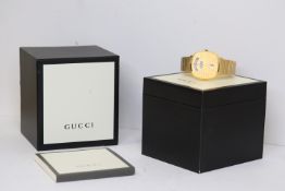 GUCCI REF 157.3 WITH BOX AND PAPERS 2022, jump hour display, gold plated case and bracelet, 38mm