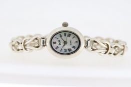 LADIES 'YR' SILVER, MOP QUARTZ WATCH, Approx 18.5mm case with snap on case back. An oval shaped