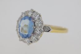 18 carat yellow gold oval aquamarine and diamond cluster ring with diamonds at the tip of the