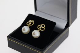 Pair 9ct yellow gold round freshwater pearl and diamond pinwheel earrings, boxed. Diamonds 0.05ct