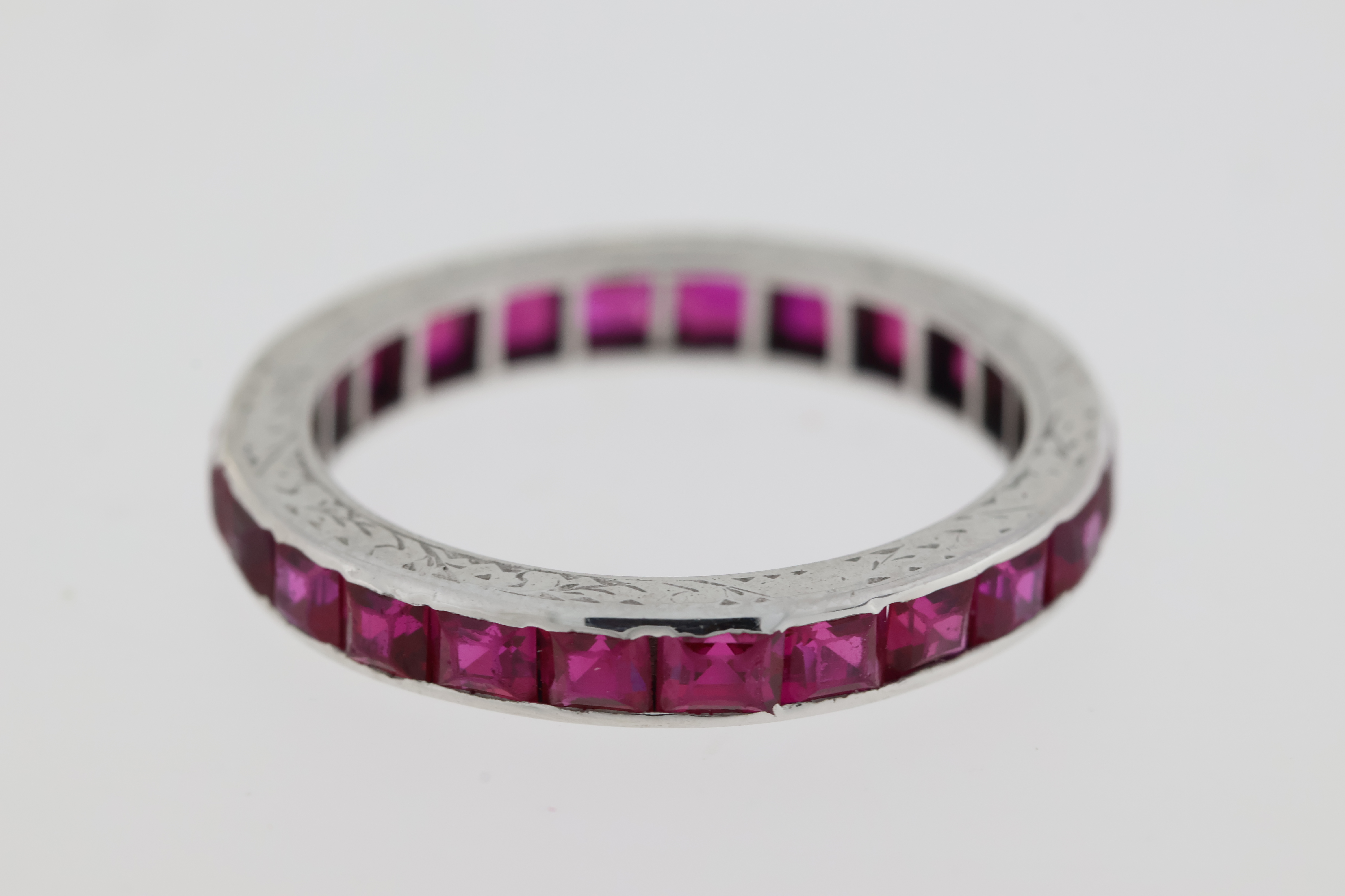 Vintage 18 carat white gold full eternity ring set with rubies, The sides are etched. - Image 2 of 4