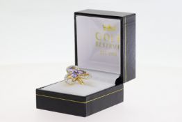 Large stylish 18ct yellow gold tanzanite and diamond cocktail ring, boxed. Pear-shaped tanzanites