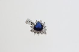 Silver heart-shaped pendant with central blue CZ and a halo of round white CZs