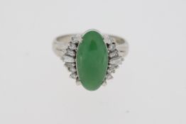 Platinum, marked 900 oval cabochon jade and diamond ring.
