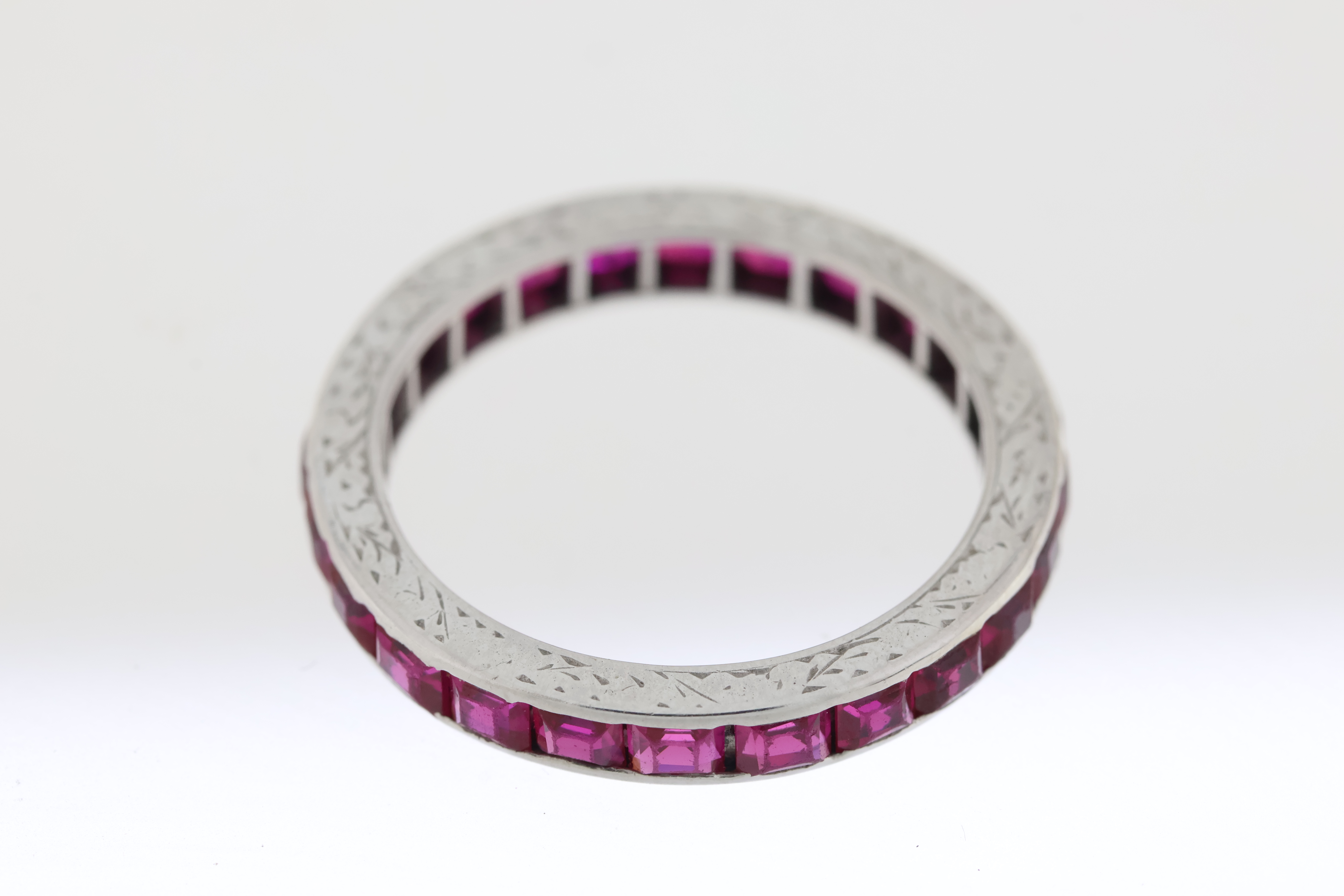 Vintage 18 carat white gold full eternity ring set with rubies, The sides are etched. - Image 4 of 4
