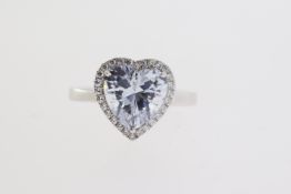 Silver ring with large heart shaped white CZ at the centre within a surround of smaller round CZs