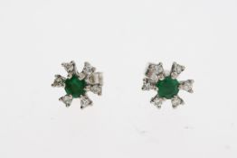 White metal green gemstone and diamond earrings. Diameter 0.8cm. Earring backs are marked 18