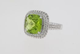 18 carat white gold peridot and diamond cluster ringWeights P4.04 D0.42