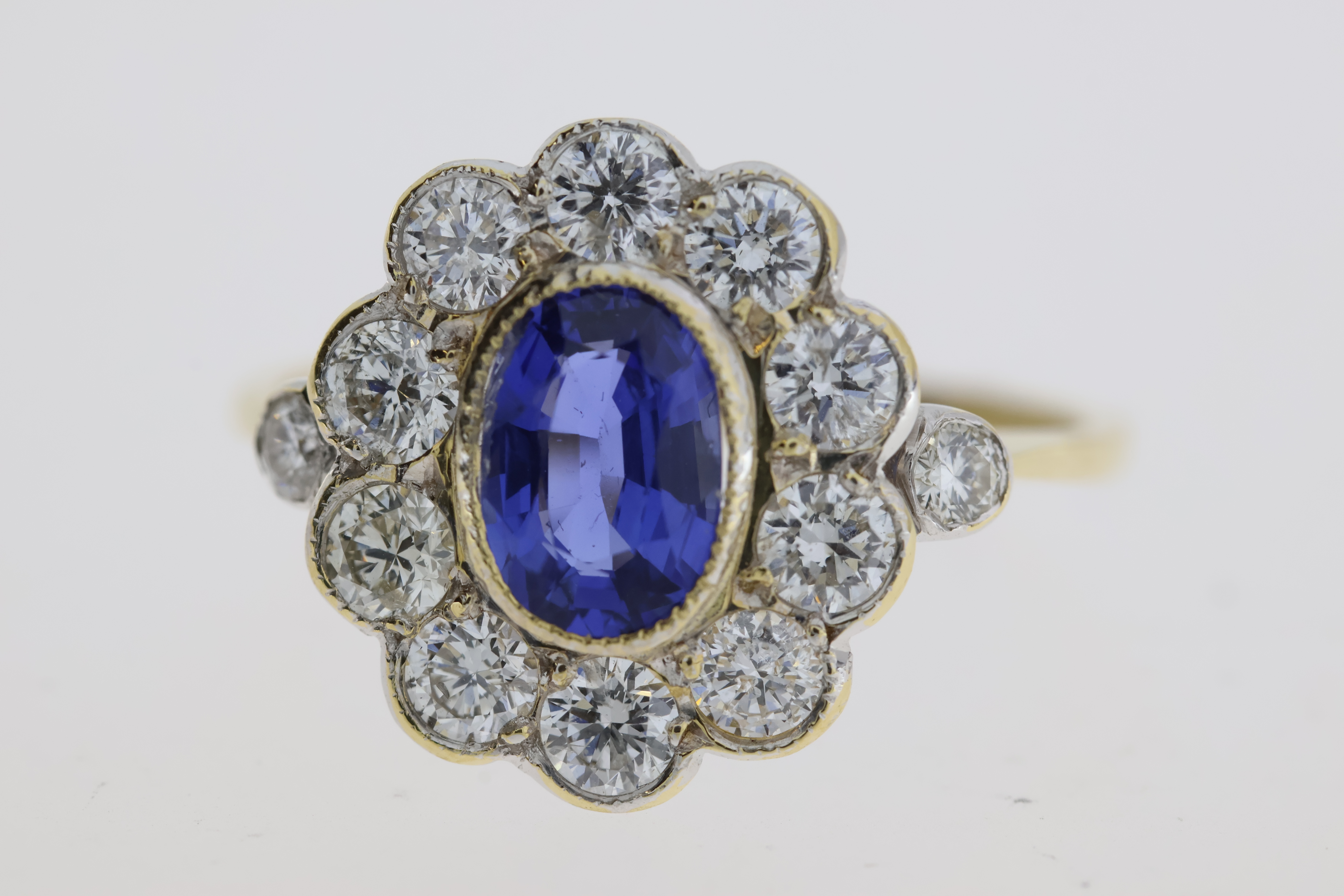 18YG oval sapphire and diamond cluster ring bezel set with a diamond at each shoulder S1ct D0.98 - Image 2 of 5