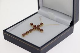 18ct yellow gold cross necklace set with 5.00ct pear-shaped garnets, boxed