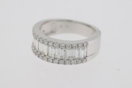 18 carat white gold baguette and round brilliant diamond band ring. Weights 2.10 cts