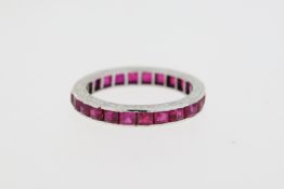 Vintage 18 carat white gold full eternity ring set with rubies, The sides are etched.