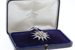 Edwadian white metal diamond star pendant. Old cut centre diamonds with rose cut diamonds. Total