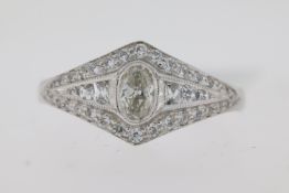 Platinum vintage inspired diamond ring. Oval centre old cut rub over set diamond. Grain set french